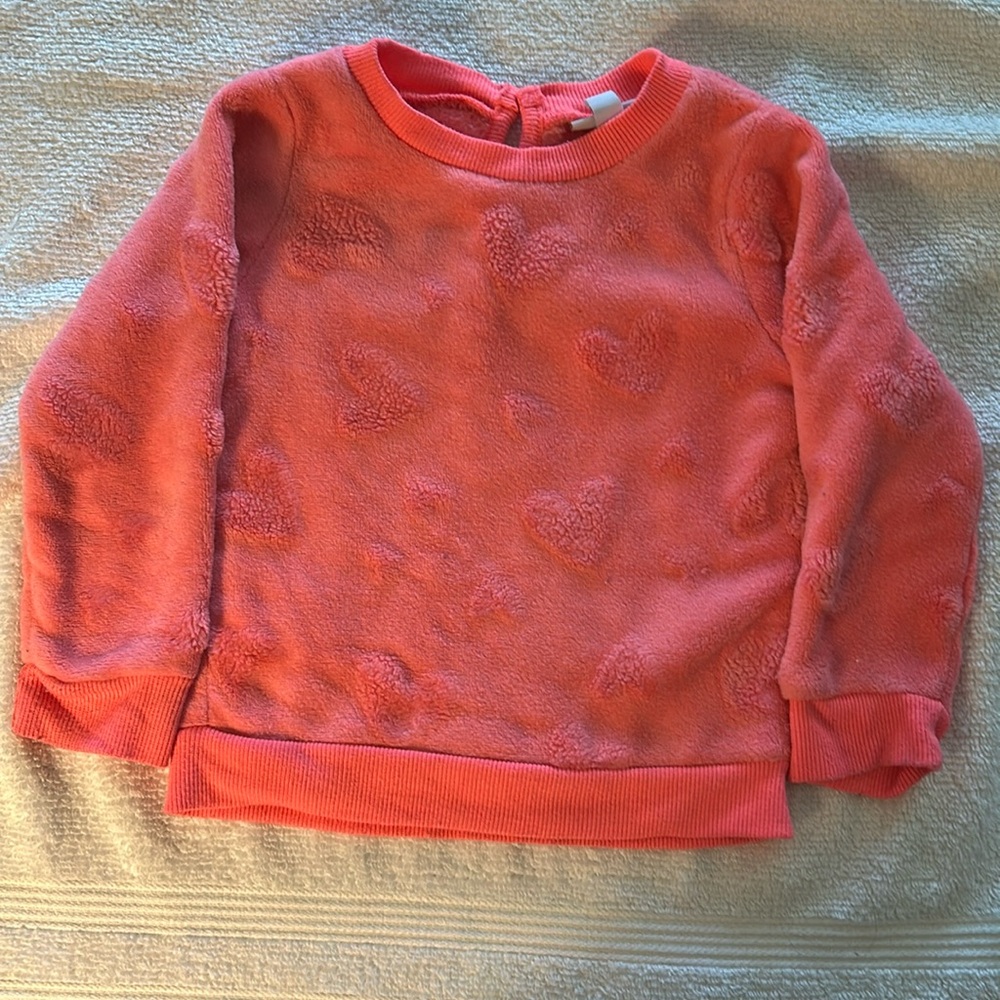 Very cute sweatshirt with hearts all over it